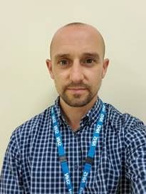 A picture containing person, person, wall, indoor

Description automatically generated
